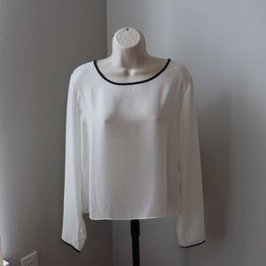 White long sleeved shirt with black outline
